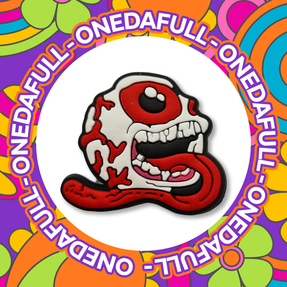 Bleeding Eyeball Skull Tongue Croc Charm