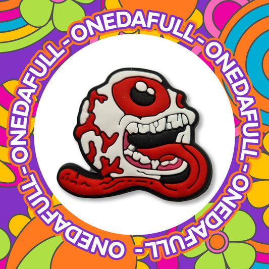 Bleeding Eyeball Skull Tongue Croc Charm