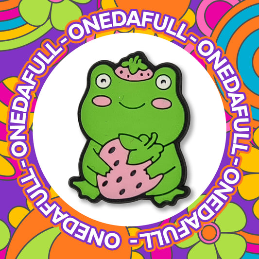 Chunky Frog Holding A Strawberry Clog Charm
